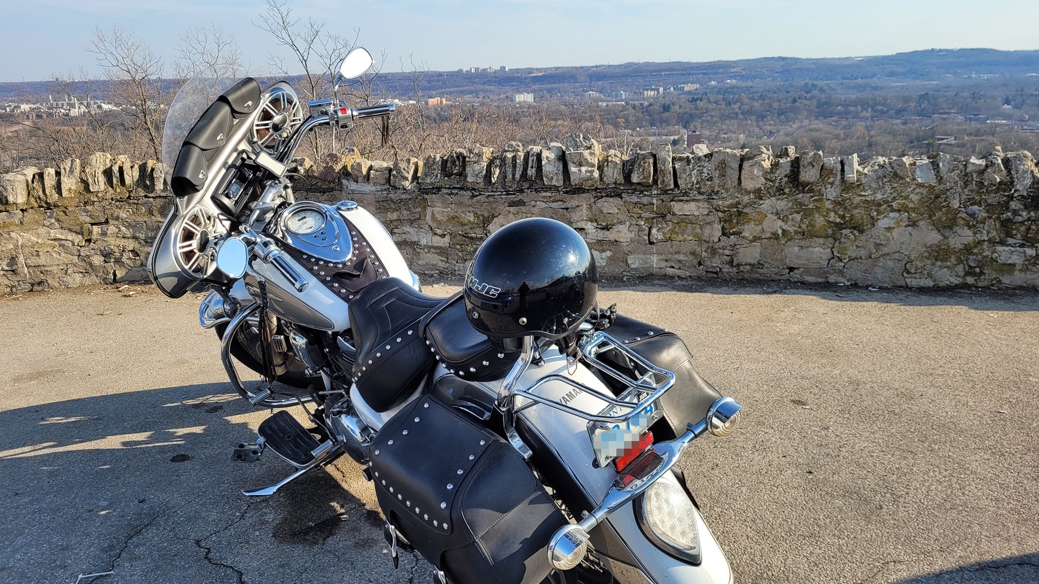 motorcycle parked by a scenic overlook